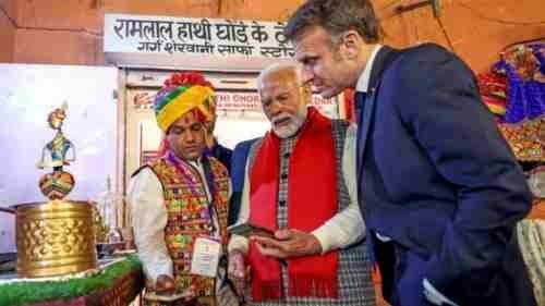 Prime Minister Narendra Modi talks about UPI to French President Emmanuel Macron in Jaipur. (ANI)